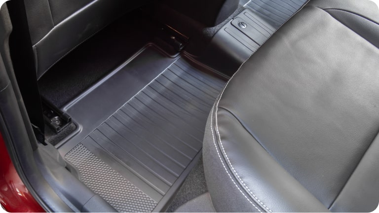 Juego de alfombras de cabina TPE para el Chevrolet Onix.