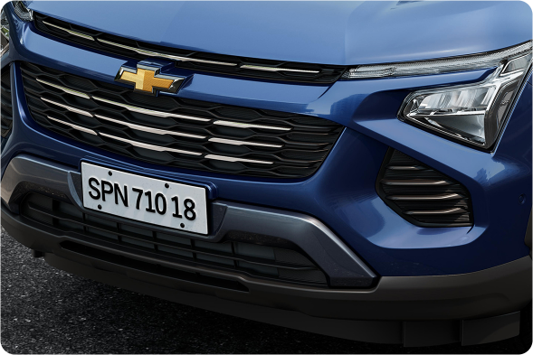 Parrilla frontal del Chevrolet Spin 2026, diseño moderno y distintivo que resalta la identidad y estilo del SUV familiar.