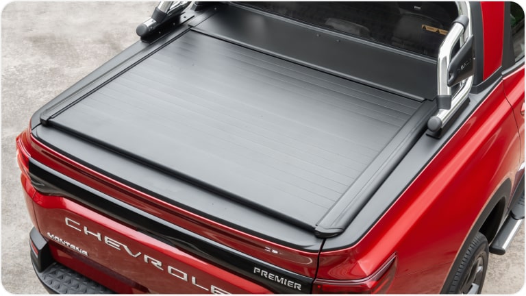 Cubierta de lona marítima rígida retráctil manual para la Chevrolet Montana.